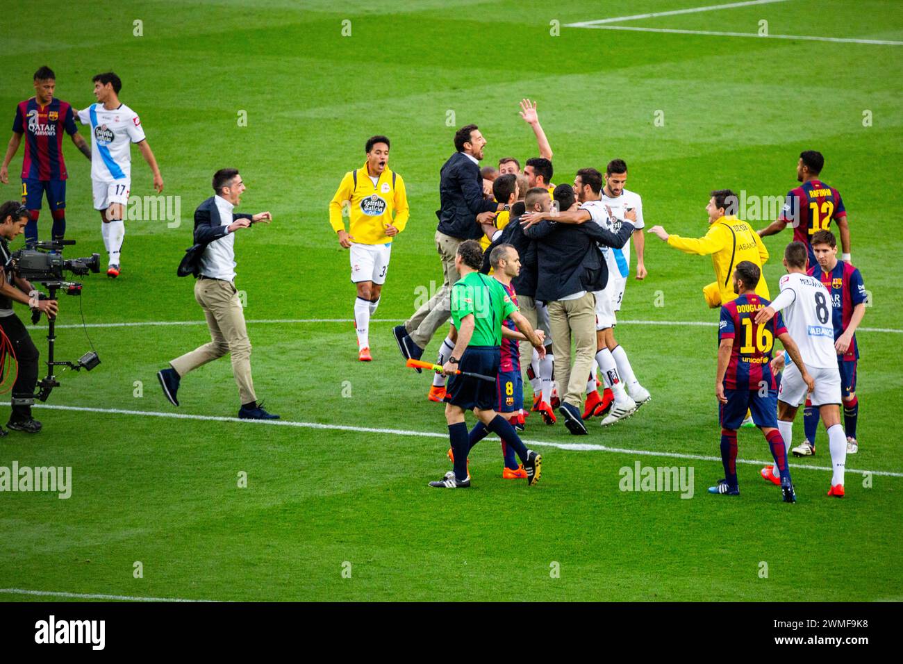 DEPORTIVO, ESCAPE LA LIGA RELEGATION, 2015: Deportivo players celerate wildly at the final whistle as the point ensures La Liga survival. The final game of the La Liga 2014-15 season in Spain between Barcelona FC and Deportivo de La Coruna at Camp Nou, Barcelona on May 23 2015. The Game finished 2-2. Barcelona celebrated winning the championship title and legend Xavi's final home game. Deportiva got the point they needed to avoid relegation. Photograph: Rob Watkins Stock Photo