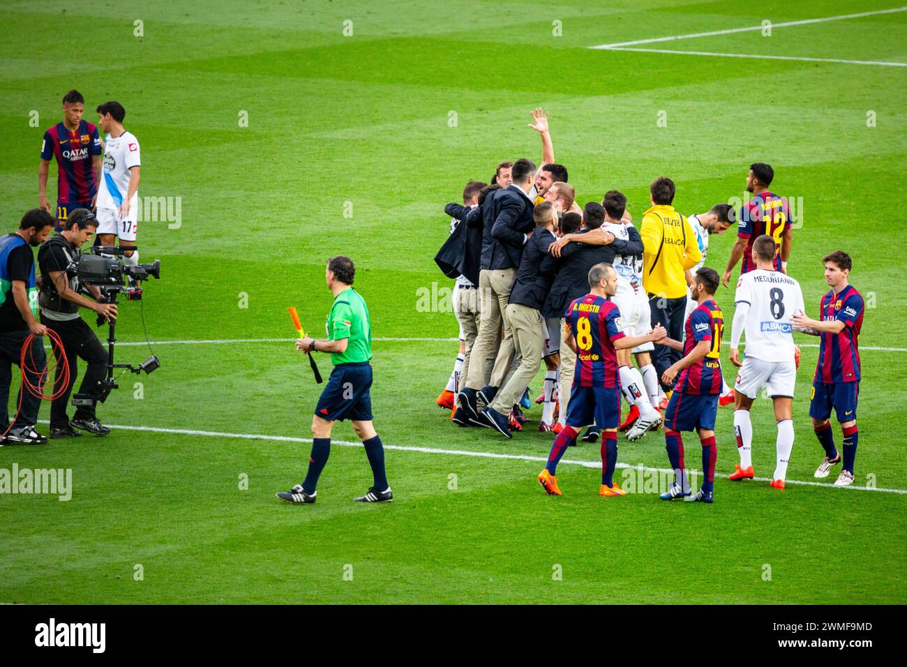 DEPORTIVO, ESCAPE LA LIGA RELEGATION, 2015: Deportivo players celerate wildly at the final whistle as the point ensures La Liga survival. The final game of the La Liga 2014-15 season in Spain between Barcelona FC and Deportivo de La Coruna at Camp Nou, Barcelona on May 23 2015. The Game finished 2-2. Barcelona celebrated winning the championship title and legend Xavi's final home game. Deportiva got the point they needed to avoid relegation. Photograph: Rob Watkins Stock Photo
