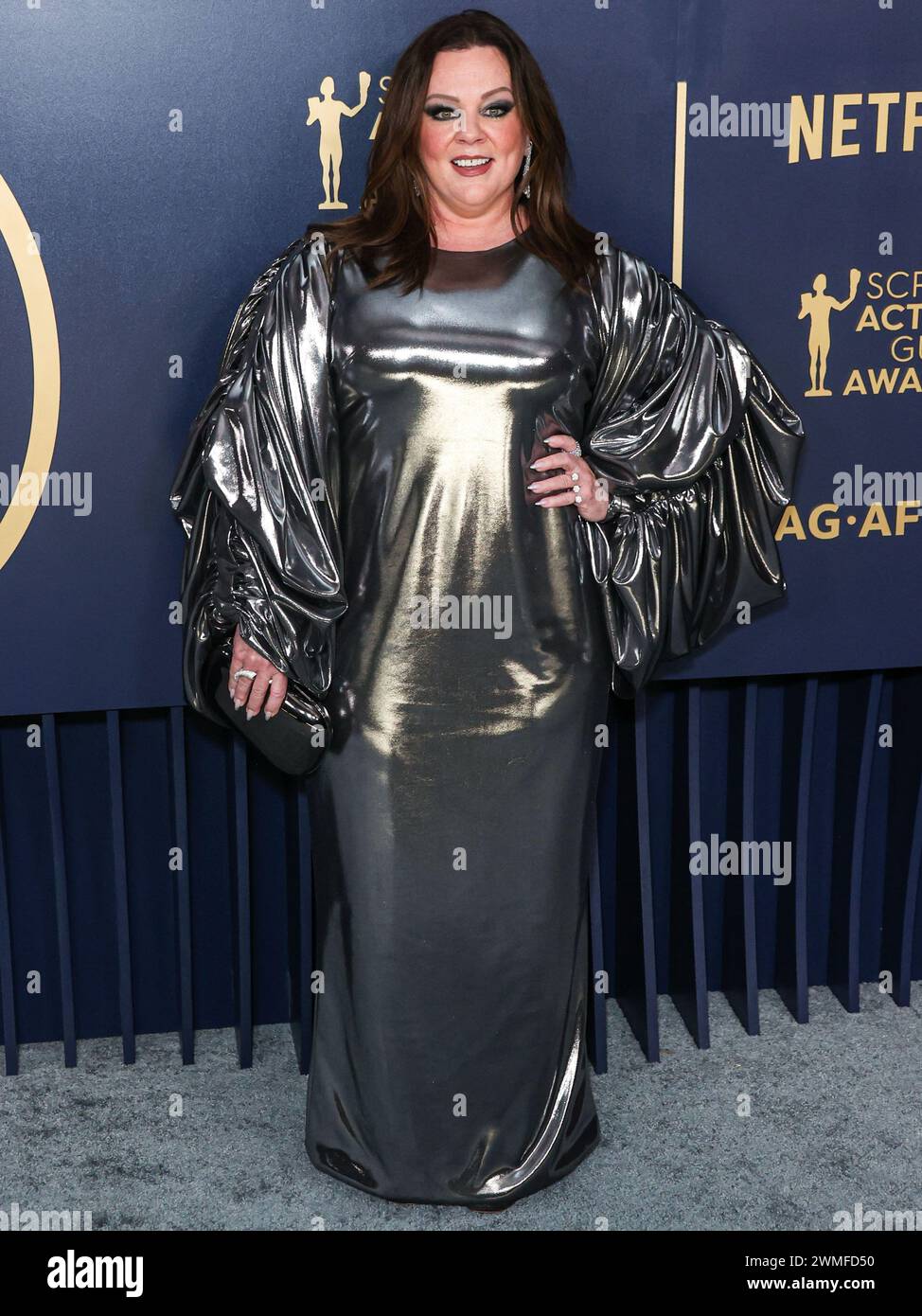 LOS ANGELES, CALIFORNIA, USA FEBRUARY 24 Melissa McCarthy wearing a Puey Quinones dress and
