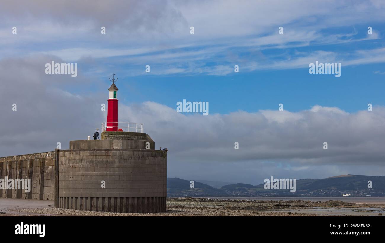 Watchet Harbour Lighthouse at low tide, Somerset, UK Stock Photo