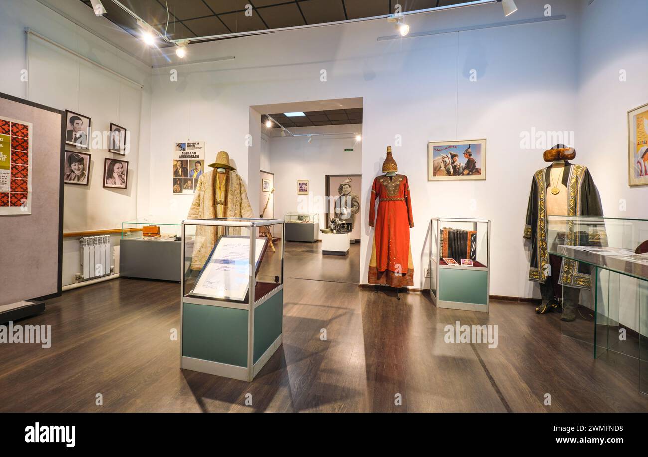 A gallery room featuring items from the local film, movie industry. Various Silk Road, Mongol era costumes on display. At the Almaty Museum of Local H Stock Photo