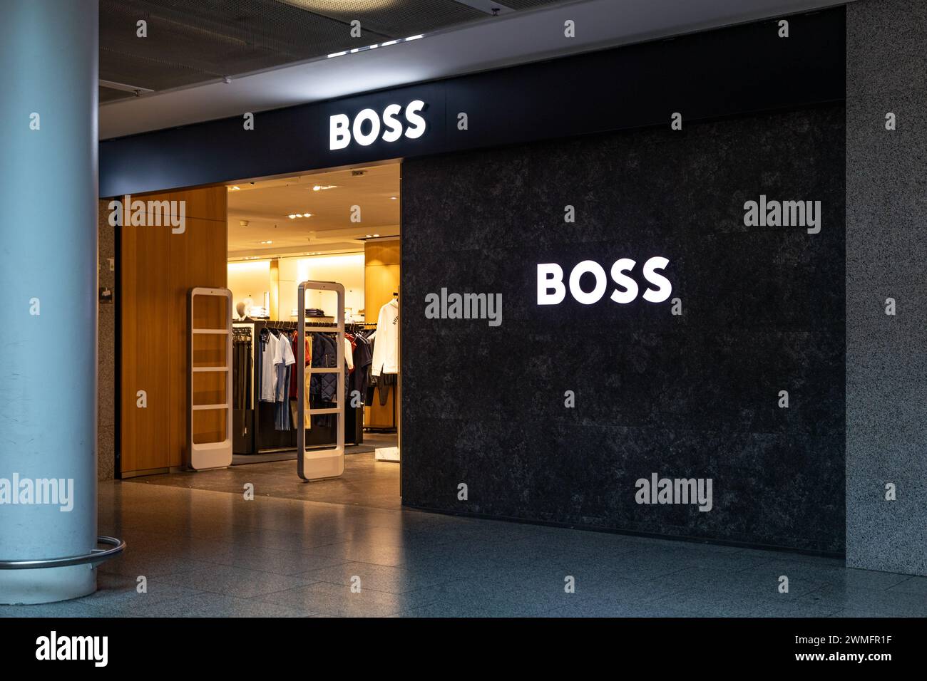 Frankfurt Airport, Germany - February 19, 2024: entrance of the Boss store in the airport shopping mall. Boss is a German luxury fashion design and fa Stock Photo