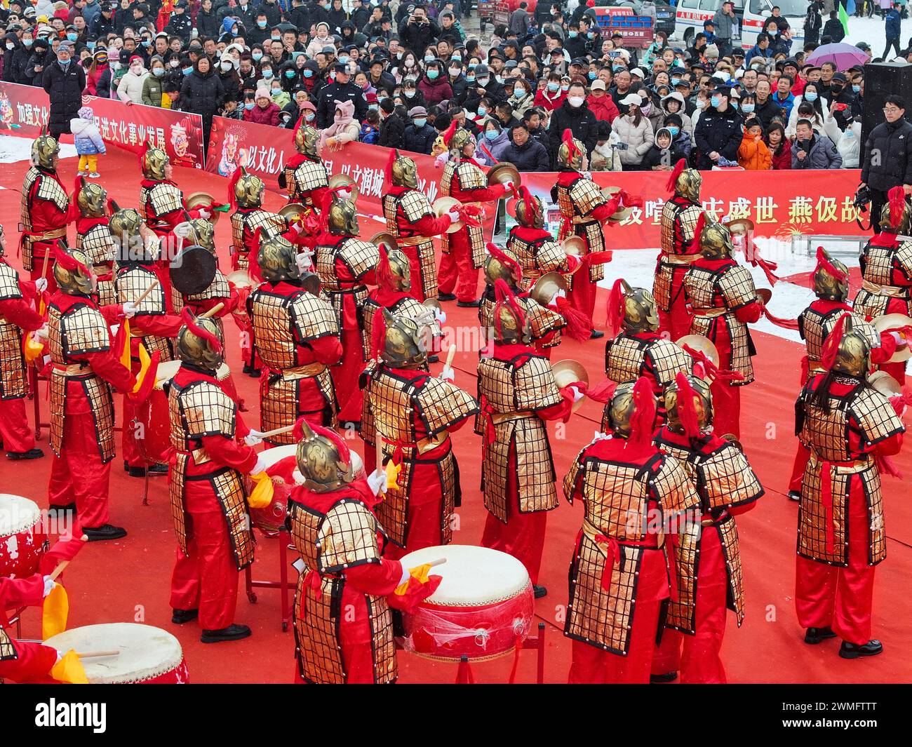 People perform gong bass drums to celebrate the Lantern Festival in