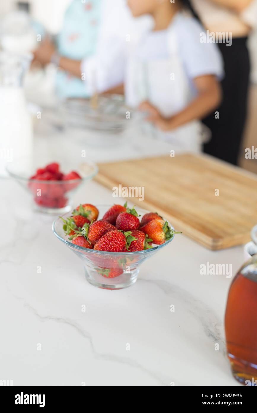 Fresh strawberries in focus on a kitchen counter, with copy space Stock Photo