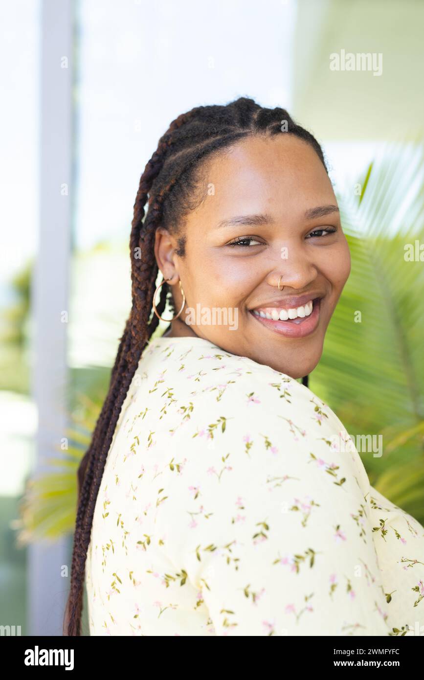 A young biracial woman smiles brightly Stock Photo