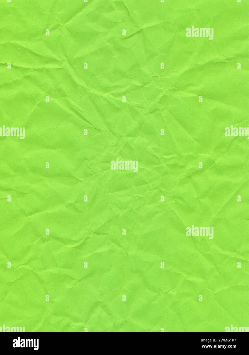 Texture of colored paper, surface of a crumpled light green sheet of paper Stock Photo