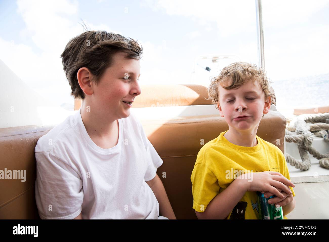 Brothers Make Silly Faces on Ferry from St Maarten to Anguilla Stock Photo