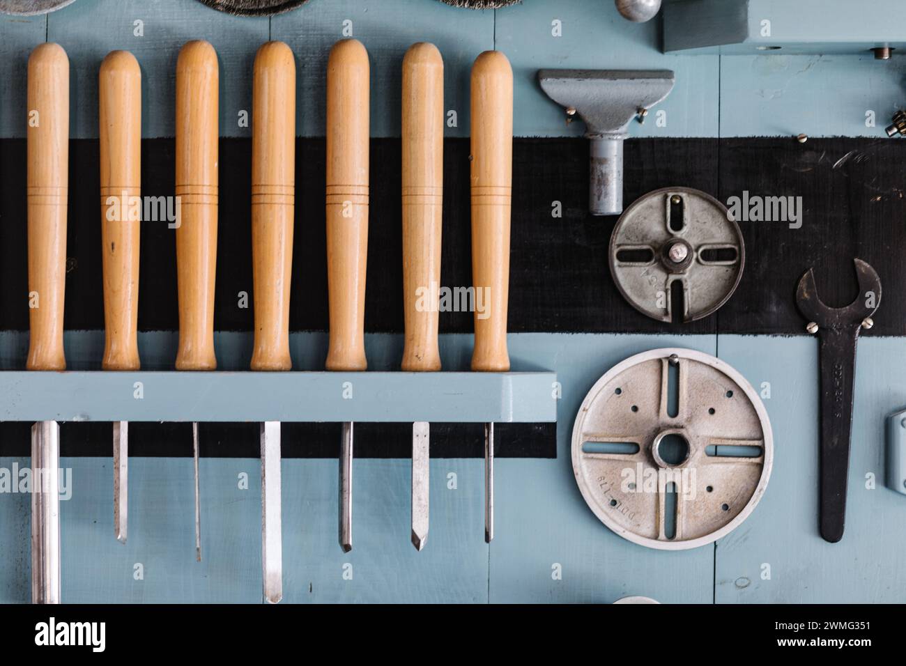 Lathe tools organized on workshop wall Stock Photo