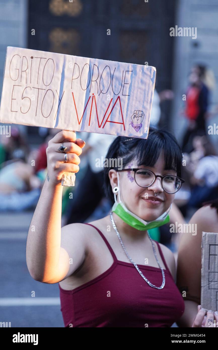 Young female raise a cartel for Women's Day Tribute Stock Photo