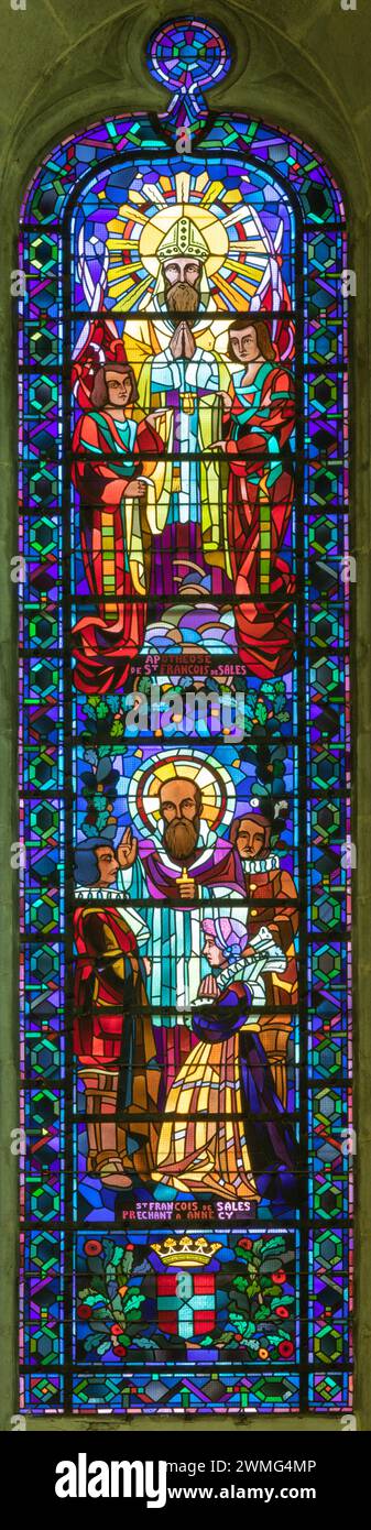 ANNECY, FRANCE - JULY 11, 2022: The modern stained glass with the St. Francis de Sales in St. Pierre Cathedral from 20. cent. Stock Photo