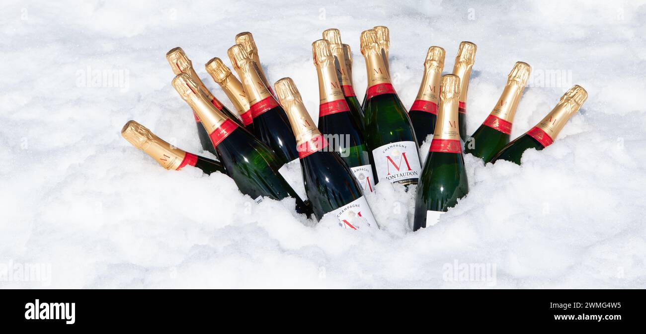 Hanusse Bay, Antarctica - January 14, 2024: Bottles of Montaudon Champagne in fresh snow for cruise ice landing celebration on Antarctica. Stock Photo