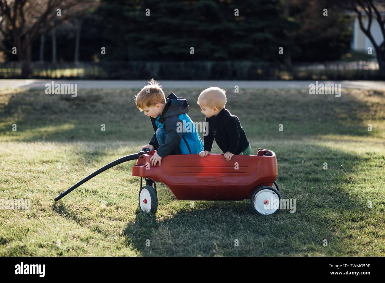 Boy pulling wagon hi-res stock photography and images - Alamy