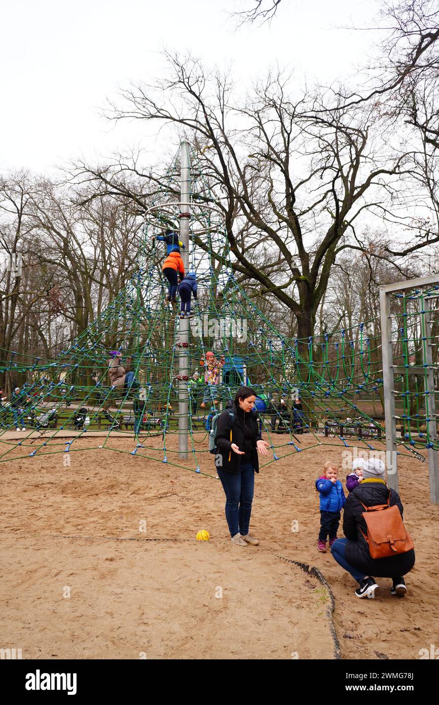 The parents and children in a playground in Solacki Park. Poznan, Poland Stock Photo