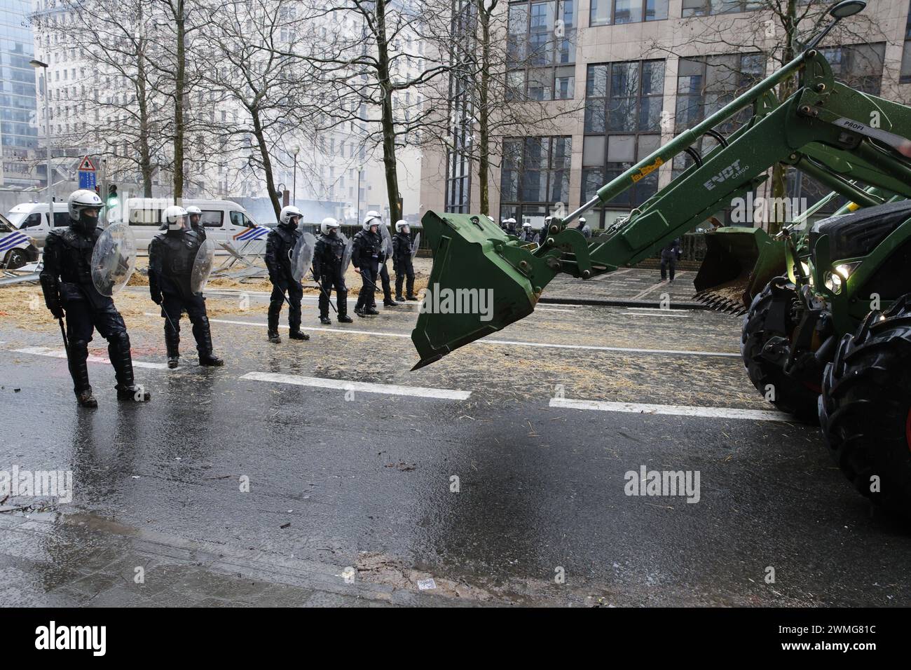 Brussels, Belgium. 26th Feb, 2024. Police pictured during a protest action of farmers' organizations 'Federation Unie de Groupements d'Eleveurs et d'Agriculteurs' (FUGEA), Boerenforum and MAP, organized in response to the European Agriculture Council, in Brussels, Monday 26 February 2024. Farmers continue their protest across Europe as they demand better conditions to grow, produce and maintain a proper income. BELGA PHOTO NICOLAS MAETERLINCK Credit: Belga News Agency/Alamy Live News Stock Photo