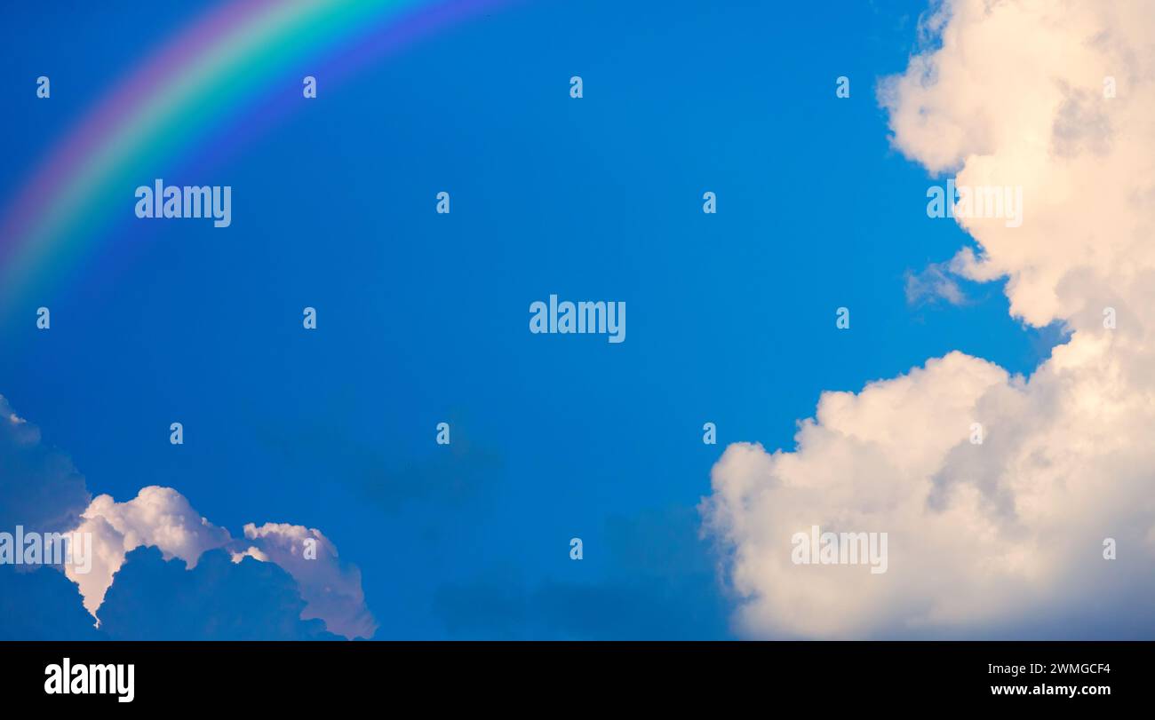 abstract blue sky background; rainbow and clouds Stock Photo - Alamy
