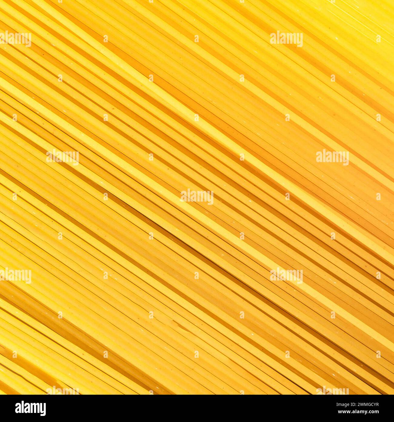 Background Spaghetti Pasta. Thin pasta arranged in rows. Yellow Italian ...