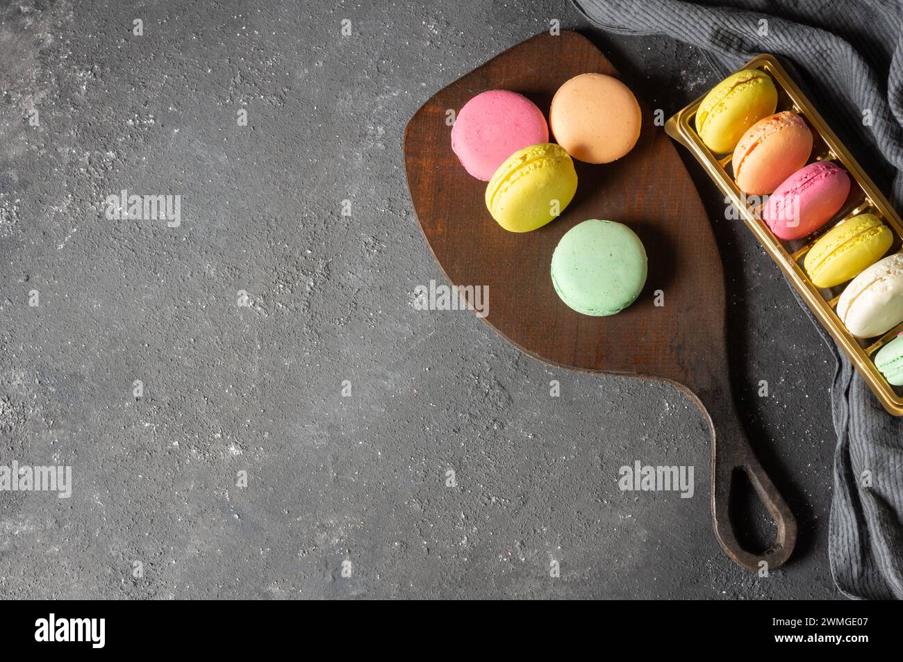 French dessert colorful macarons on rustic background Stock Photo