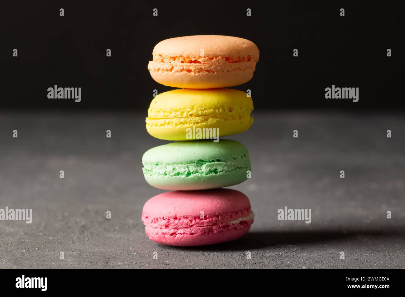 French dessert colorful macarons on rustic background Stock Photo
