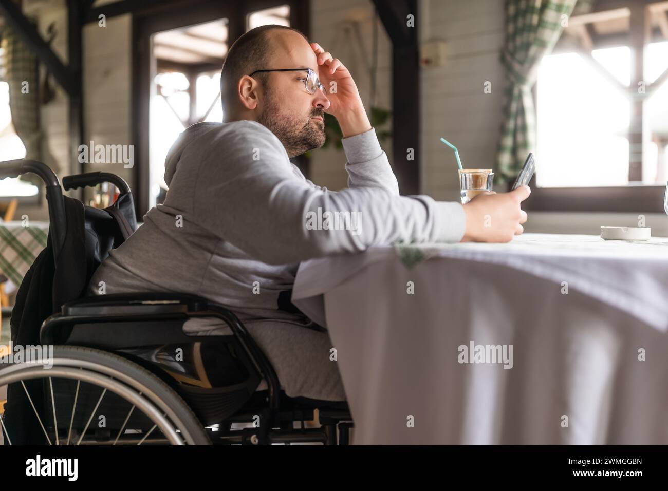 Handicapped person in cafe hi-res stock photography and images - Alamy