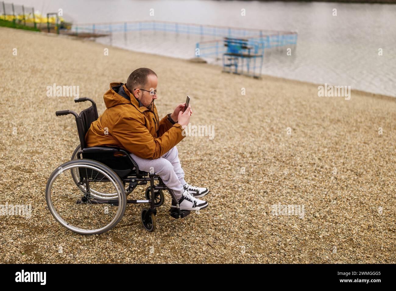 Disabled man on wheelchair using hi-res stock photography and images ...