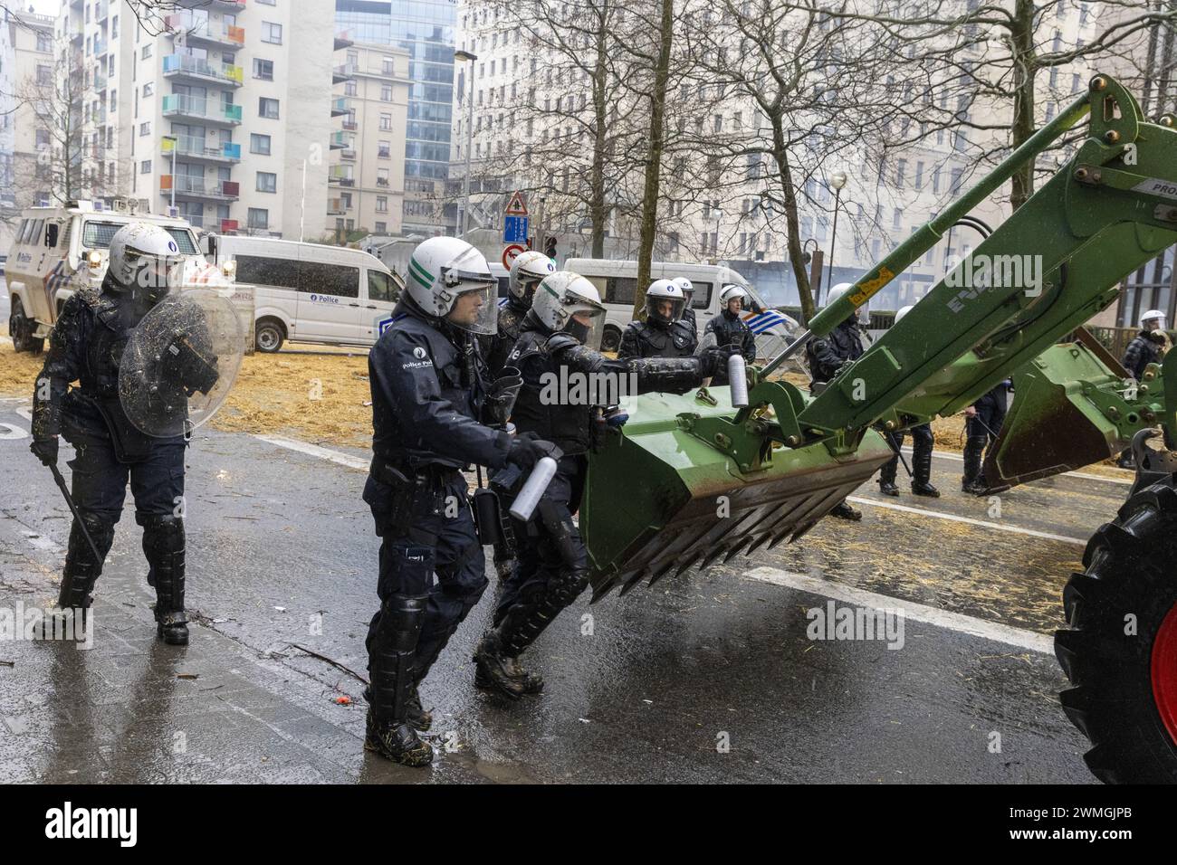 Brussels, Belgium. 26th Feb, 2024. Police pictured during a protest action of farmers' organizations 'Federation Unie de Groupements d'Eleveurs et d'Agriculteurs' (FUGEA), Boerenforum and MAP, organized in response to the European Agriculture Council, in Brussels, Monday 26 February 2024. Farmers continue their protest across Europe as they demand better conditions to grow, produce and maintain a proper income. BELGA PHOTO NICOLAS MAETERLINCK Credit: Belga News Agency/Alamy Live News Stock Photo