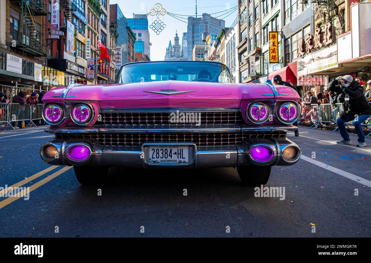 New York, New York, USA. 25th Feb, 2024. A 1959 Pink Cadillac struts in the annual Chinese Lunar New Year Parade in the historic Chinatown section of New York. This year's lunar celebration is the year of the dragon celebrating a season of planting and harvests, new beginnings, and fresh starts. (Credit Image: © Brian Branch Price/ZUMA Press Wire) EDITORIAL USAGE ONLY! Not for Commercial USAGE! Stock Photo