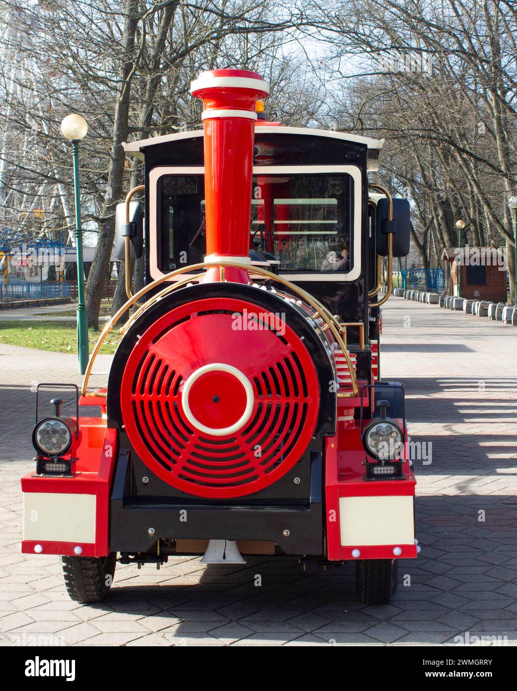 Children's train. Walk in the city's recreation park. Entertainment and leisure for children. Spring sunny day. Stock Photo