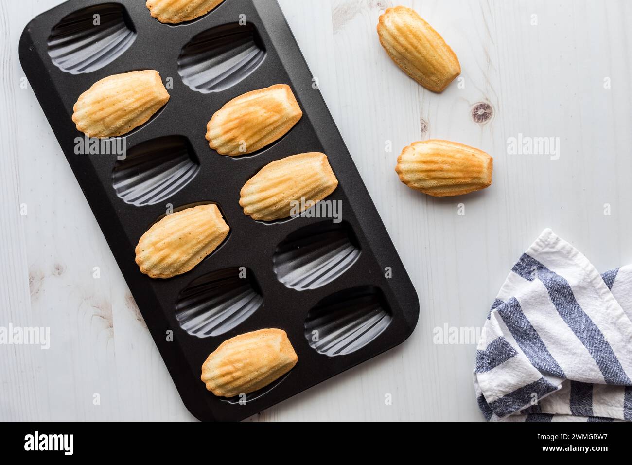 Traditional French Madeleines on a Madeleine baking tray Stock Photo