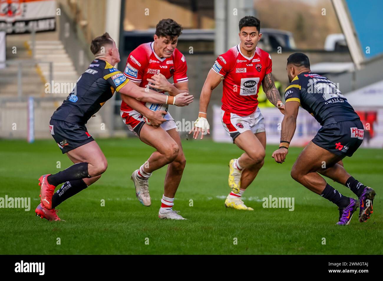 SAM STONE running the ball into the defence of the tigers. Salford Red Devils Vs Castleford Tigers Betfred Super League Round 2, Salford Community Stadium, 25th February 2024. Credit: James Giblin/Alamy Live News. Stock Photo