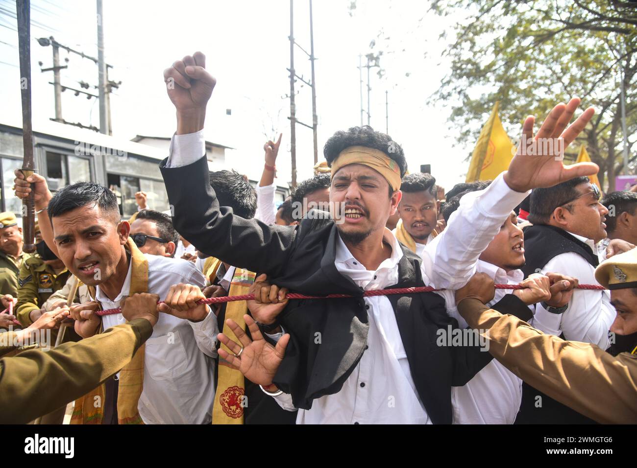GUWAHATI,INDIA-FEBRUARY 26: Members of All Tai Ahom Students Union (ATASU) raise slogans during a protest demanding Scheduled Tribes (ST) status for Tai Ahom community, in Guwahati, Monday, Feb. 26, 2024. Credit: Hafiz Ahmed/Alamy Live News Stock Photo