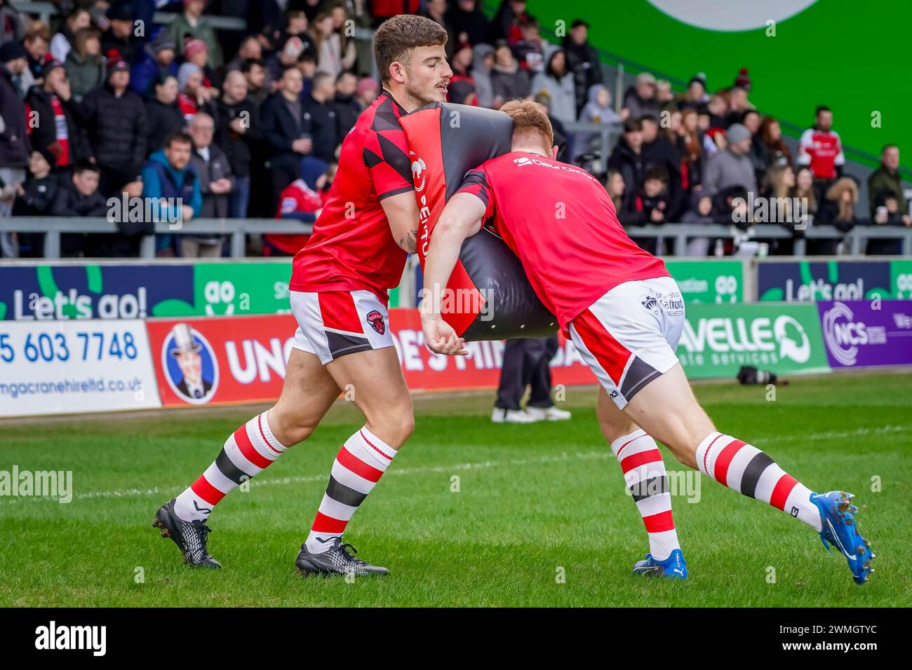 Tackle bag practice during the warm up. Salford Red Devils Vs Castleford Tigers Betfred Super League Round 2, Salford Community Stadium, 25th February 2024. Credit: James Giblin/Alamy Live News Stock Photo