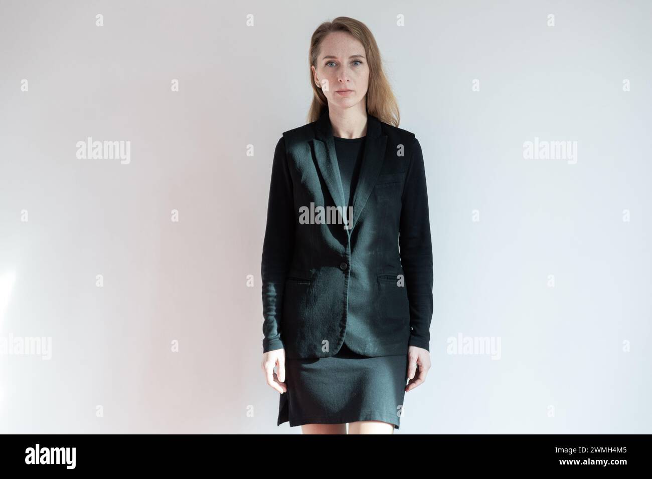 Professional woman in black suit hi-res stock photography and images ...