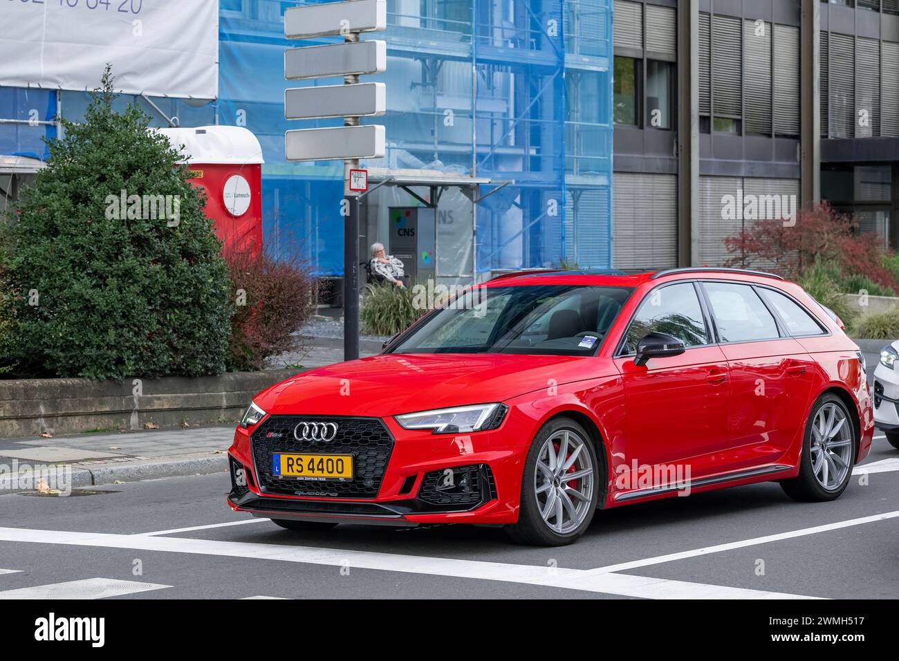 Luxembourg City, Luxembourg - Focus on a red Audi RS4 Avant B9 driving in a street. Stock Photo