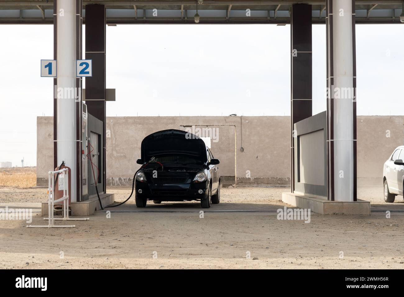 Gas station for methane. The car is refueled with gas on the street. Stock Photo