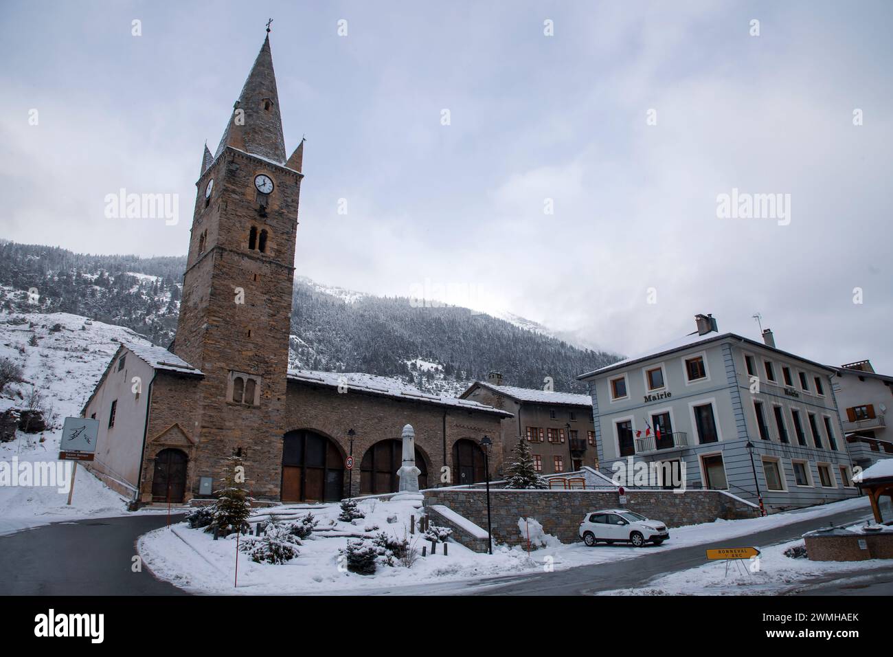 A bell tower, the monument to the fallen soldiers of the WWI and town hall of Lanslebourg, a small, picturesque town in the French Alps Stock Photo