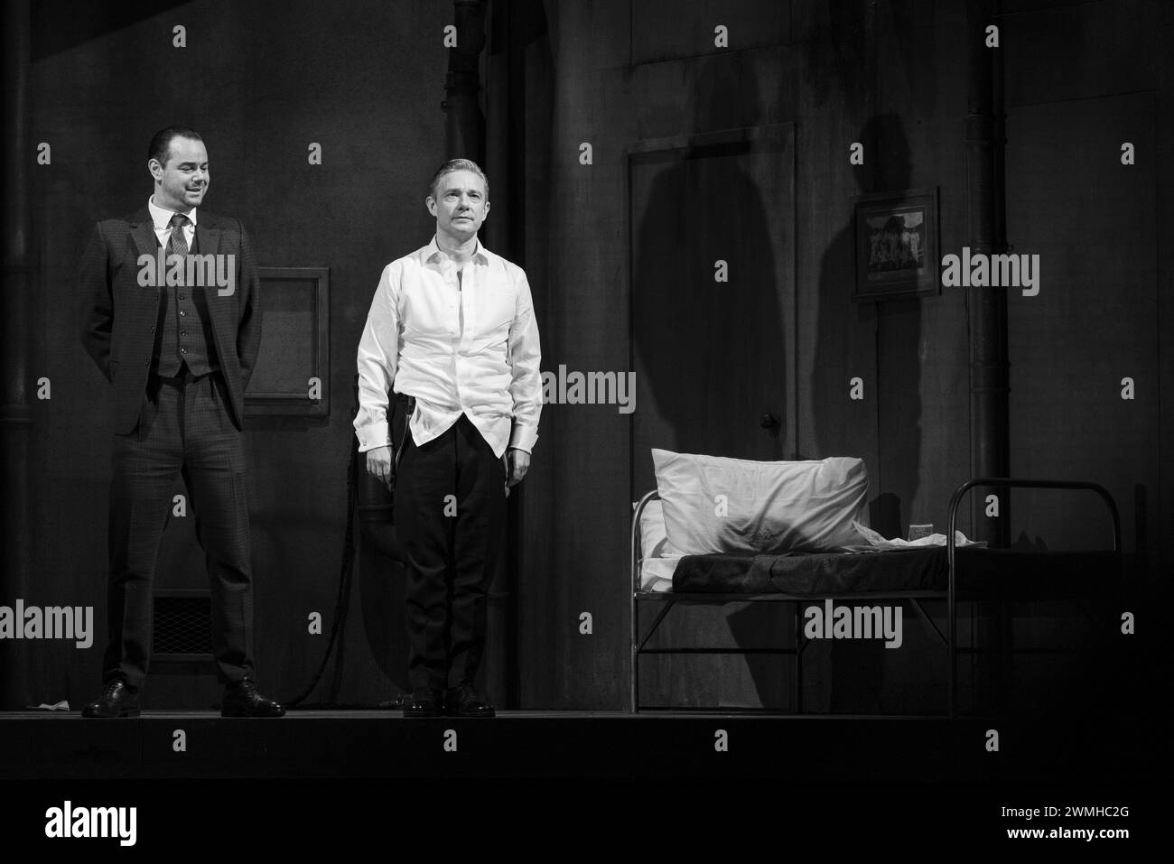 MARTIN FREEMAN, DANY DYER, PINTER PLAY, LONDON, 2019: Actors Martin Freeman and Danny Dyer in the early Harold Pinter play A Dumb Waiter (1958) take their curtain call on stage at the Pinter Theatre in London on 6 February 2019. Photo: Rob Watkins.  INFO: 'The Dumb Waiter' by Harold Pinter is a one-act play that delves into themes of existentialism and absurdity. Set in a basement, it follows two hitmen awaiting their next assignment, navigating cryptic messages from an unseen employer, leading to tension and existential questioning. Stock Photo