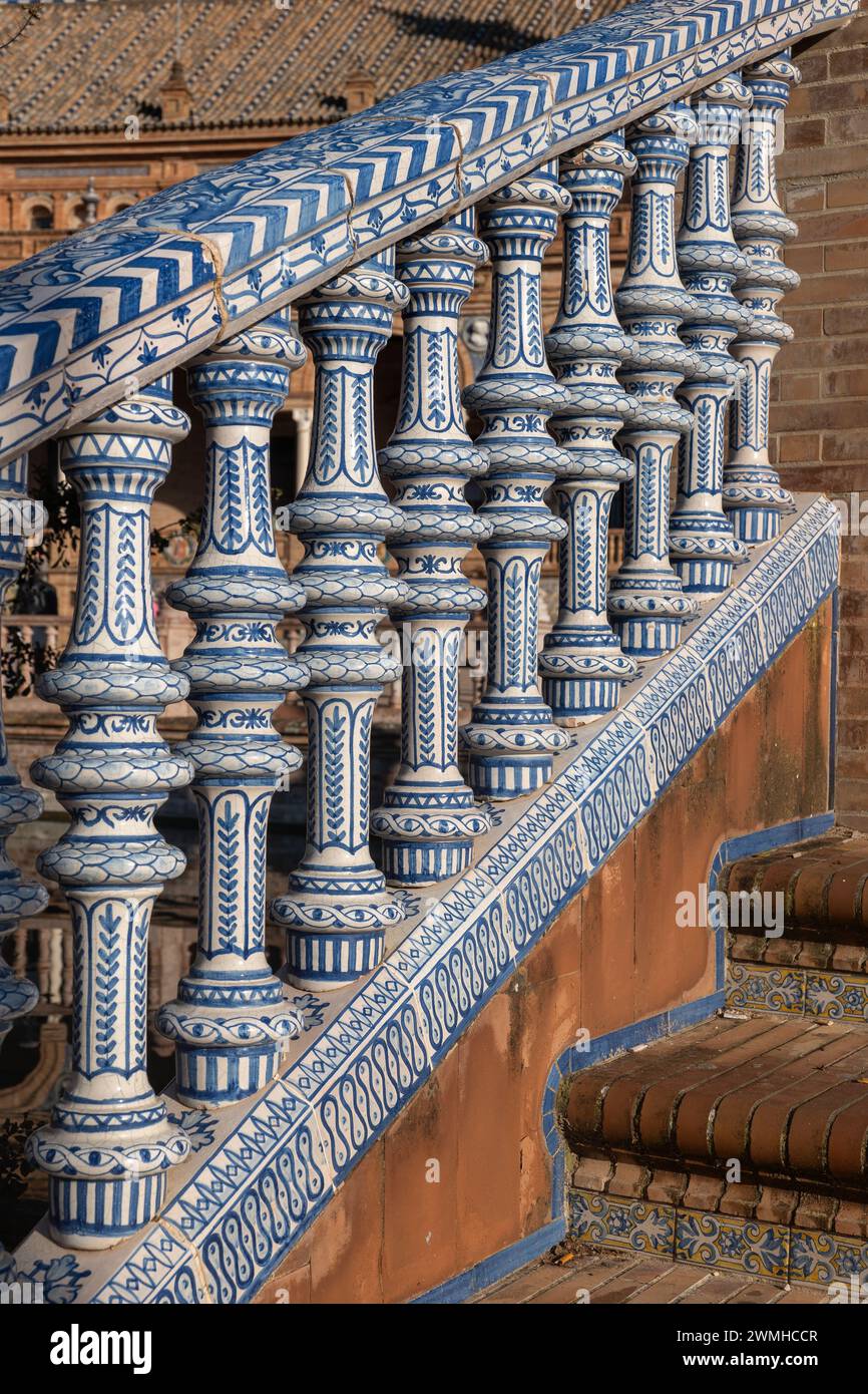 Bridge balustrade decorated with azulejos ceramic tiles at Plaza de Espana in Seville, Andalusia, Spain. Stock Photo