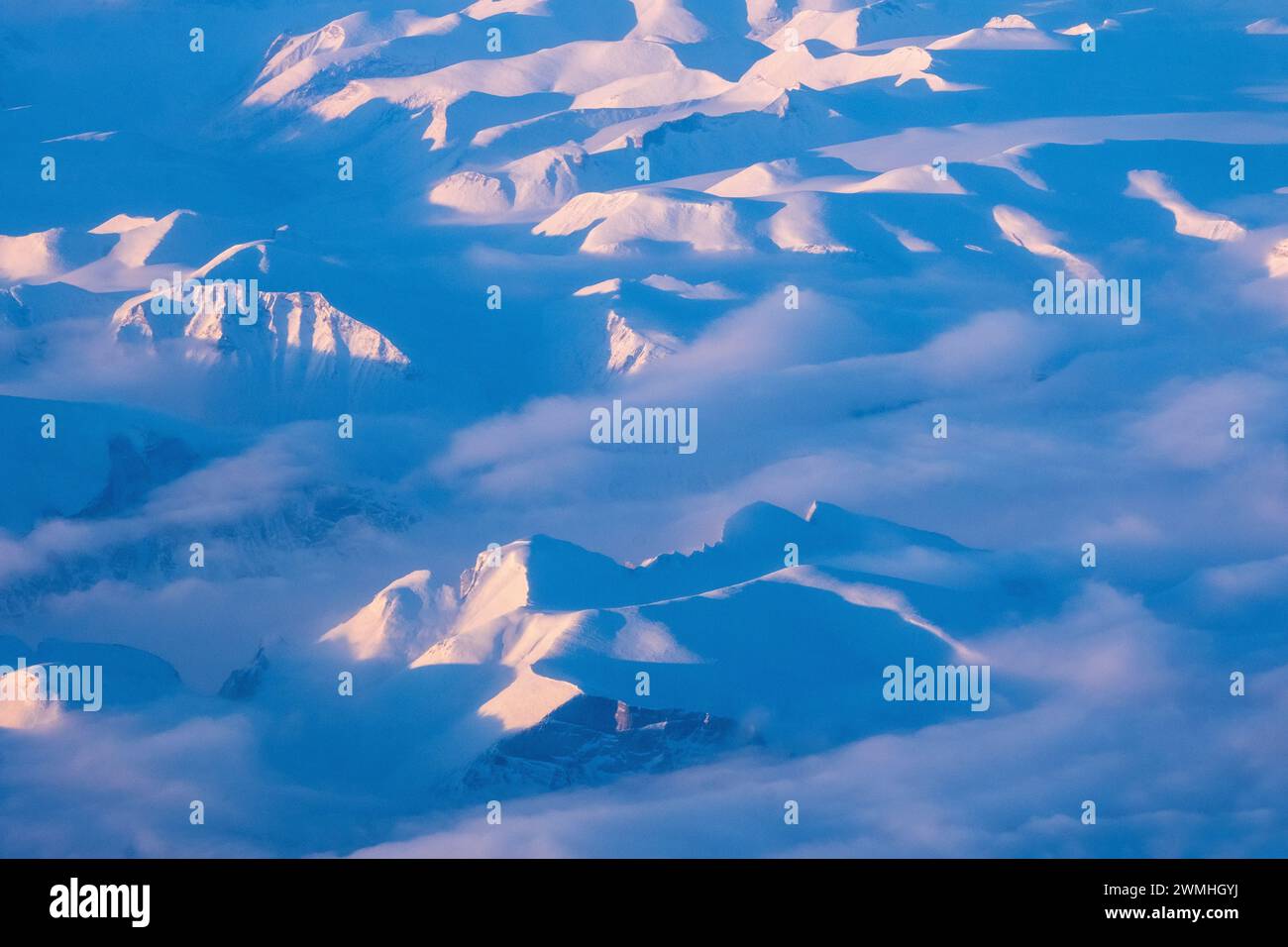 Aerial view over mountains in eastern Greenland in the winter Stock Photo