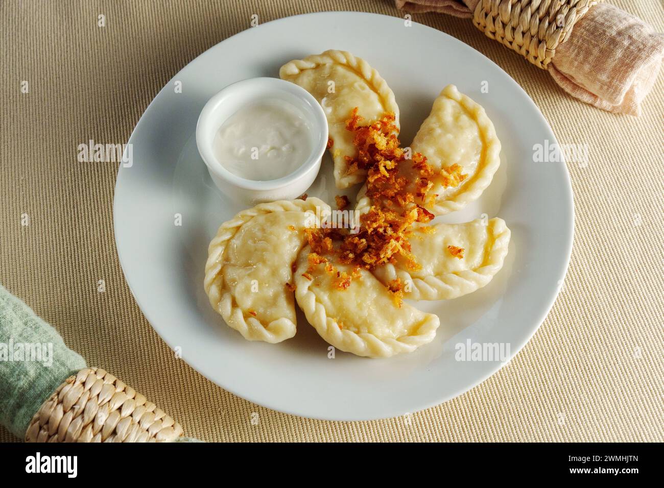 Delicate Pleasures: A Luxurious Feast of Dumplings and Exquisite Dip Stock Photo