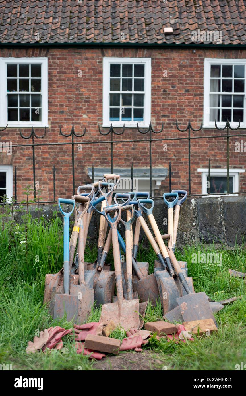 Spades and shovels at an archaeological dig, UK Stock Photo