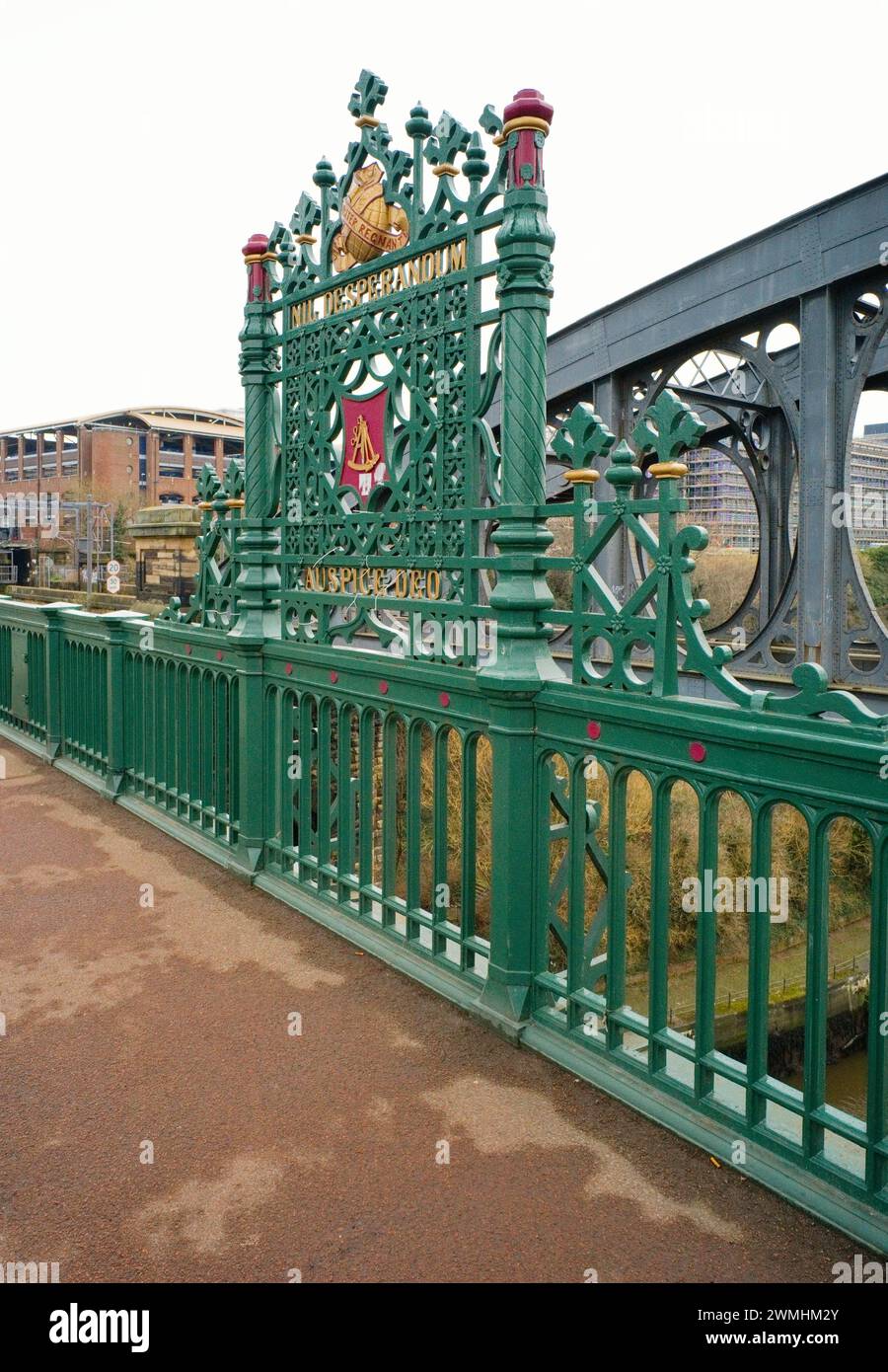 Cast iron marker on river Wear bridge showing coat of arms of