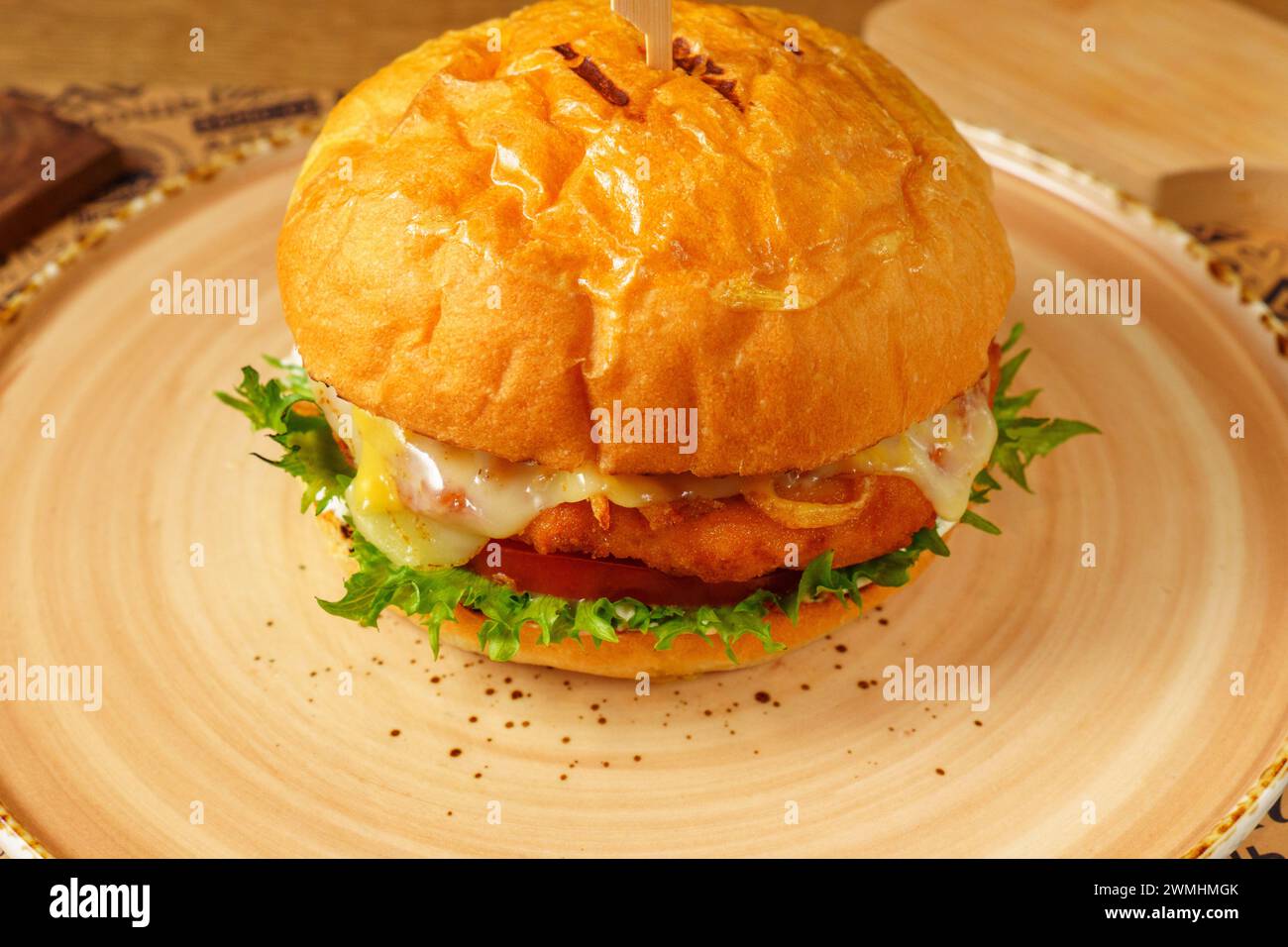 Cheeseburger With Lettuce and Tomato on Bun, close up Stock Photo