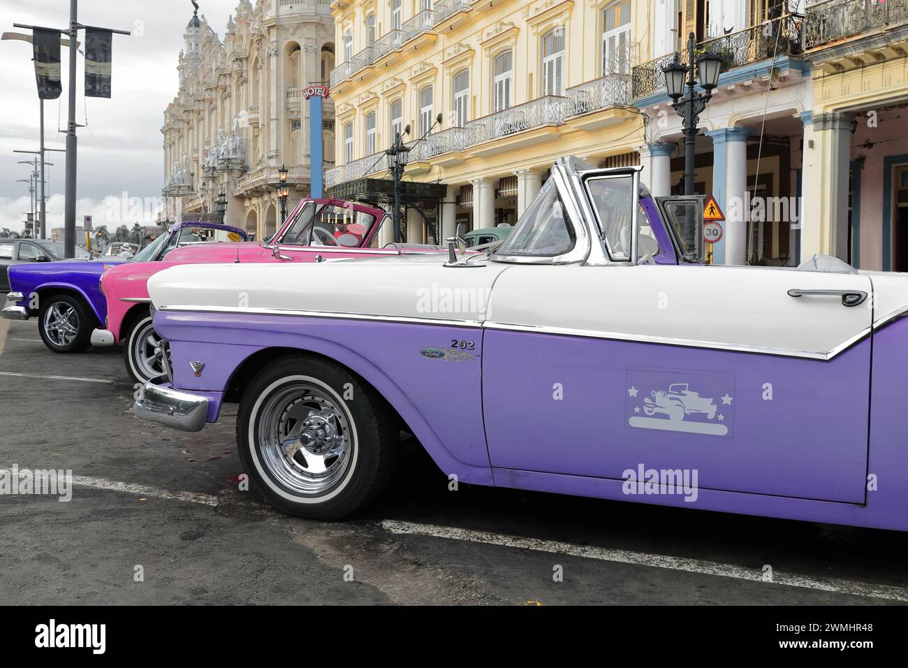 018 Purplish blue-pink-lilac blush almendron cars -yank tank Dodge-Chevrolet-Ford American classics from 1957-52-57- on Paseo del Prado. Havana-Cuba. Stock Photo