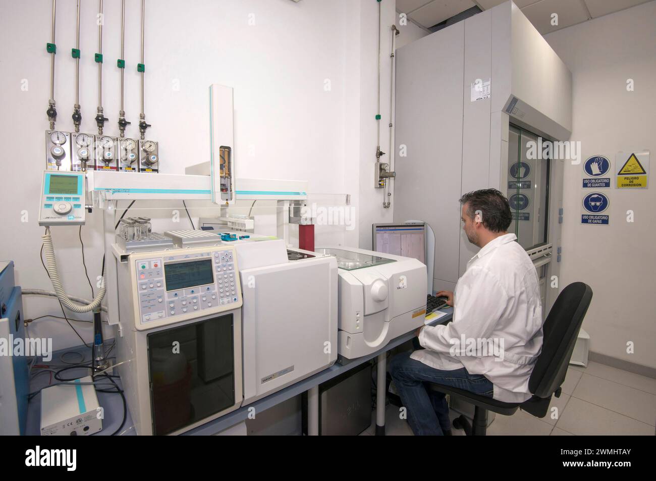 Technician in the quality control room of a water distribution company Stock Photo