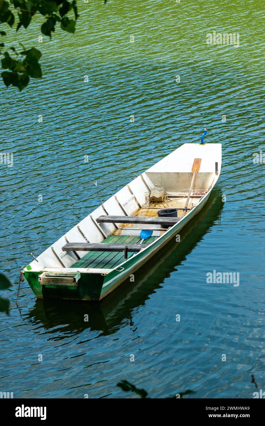 Fishing boat left alone in the lake. Stock Photo