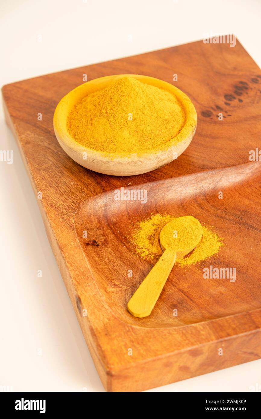 ground turmeric on a wood Stock Photo Alamy