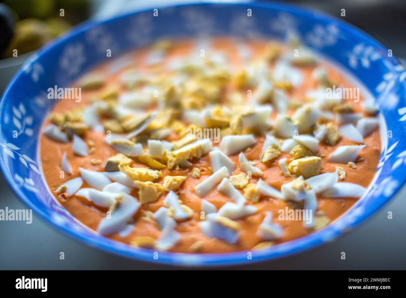 Traditional Andalusian salmorejo soup garnished with chopped boiled