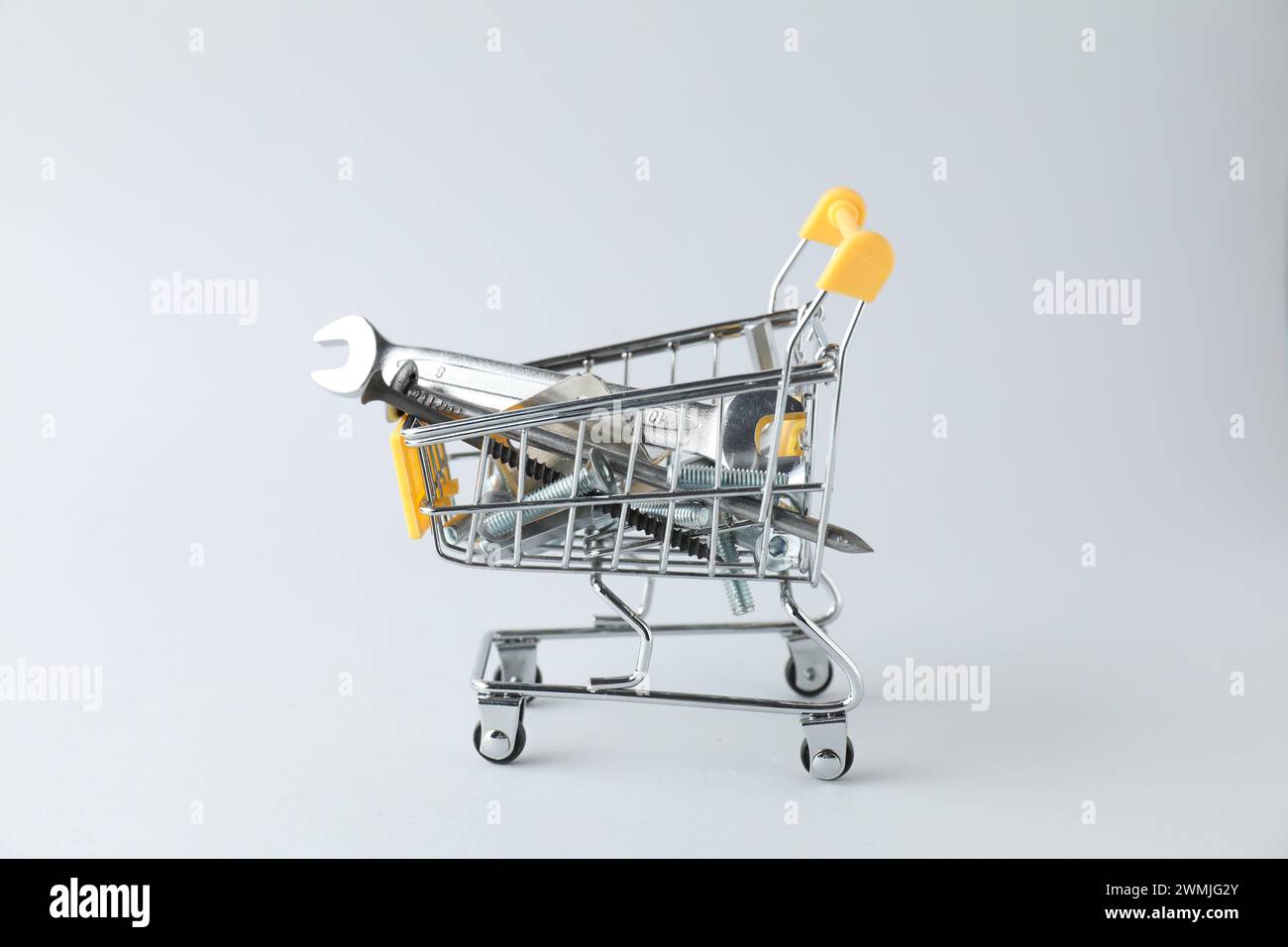 Different construction tools on light grey background Stock Photo - Alamy