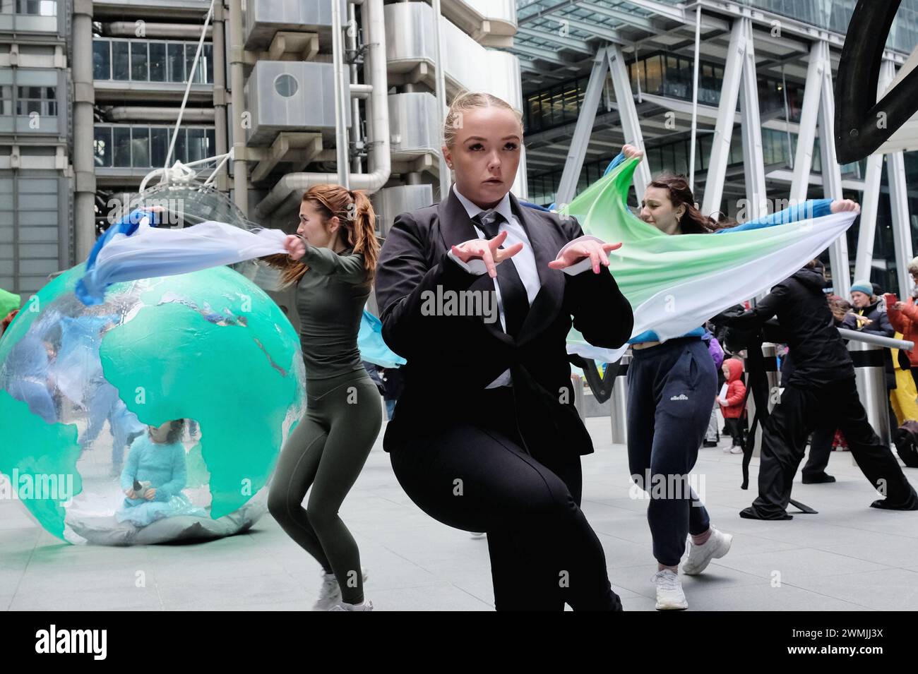 London, UK, 26th February, 2024. Environmental activist group Mothers Rise Up performed a dance piece in protest of insurer Lloyds of London, who play their part in the fossil fuel industry. The action marks the beginning of a week of protests against insurers. Credit: Eleventh Hour Photography/Alamy Live News Stock Photo