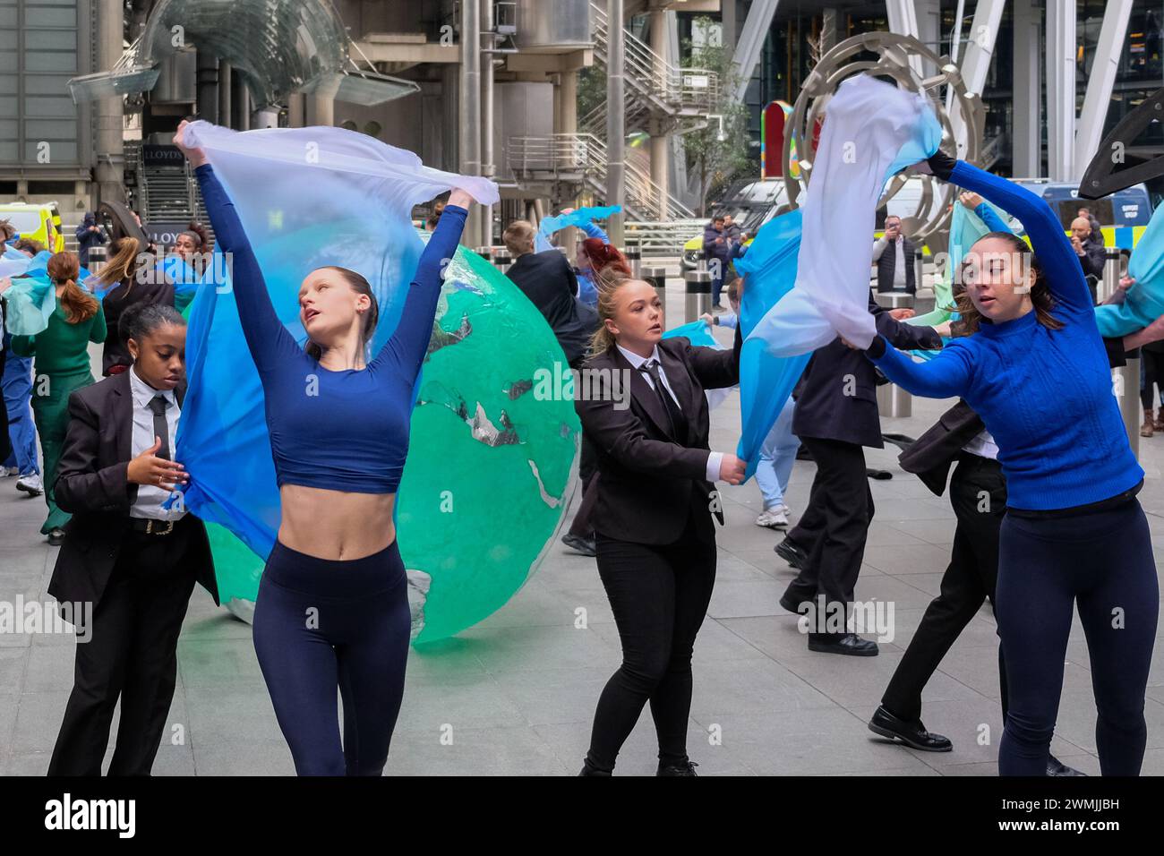 London, UK, 26th February, 2024. Environmental activist group Mothers Rise Up performed a dance piece in protest of insurer Lloyds of London, who play their part in the fossil fuel industry. The action marks the beginning of a week of protests against insurers. Credit: Eleventh Hour Photography/Alamy Live News Stock Photo